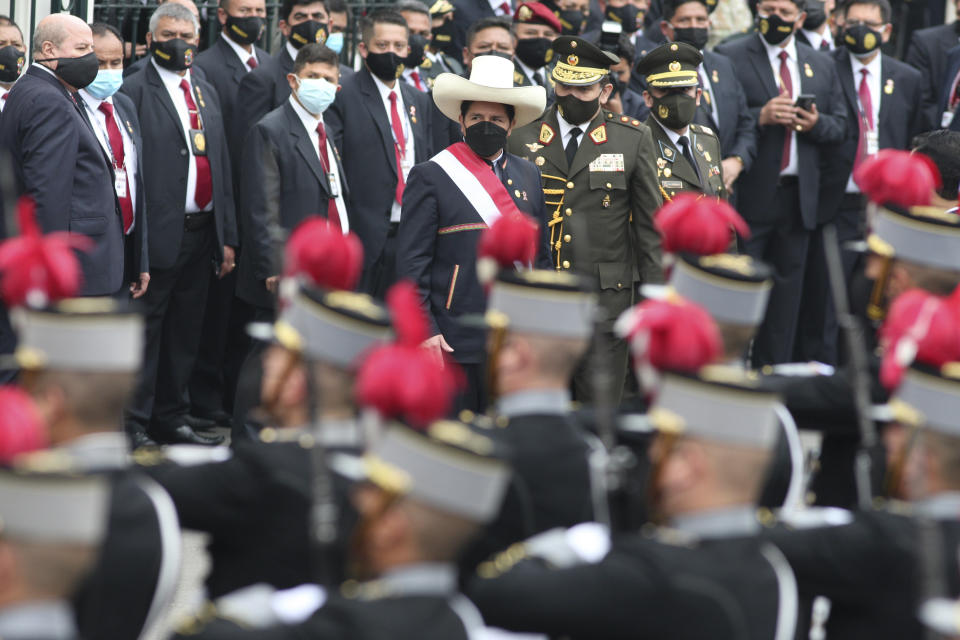 Peru's newly sworn-in President Pedro Castillo exits Congress on his inauguration day in Lima, Peru, Wednesday, July 28, 2021. (AP Photo/Francisco Rodriguez)