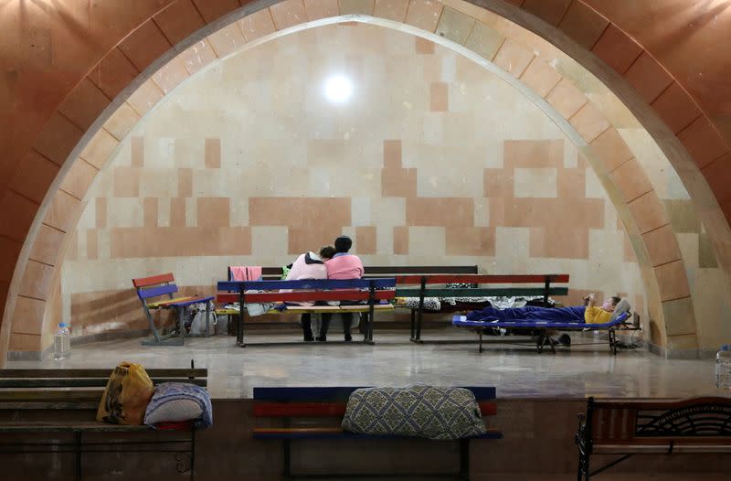 Civilians gather in a bomb shelter during a military conflict over the breakaway region of Nagorno-Karabakh in Stepanakert