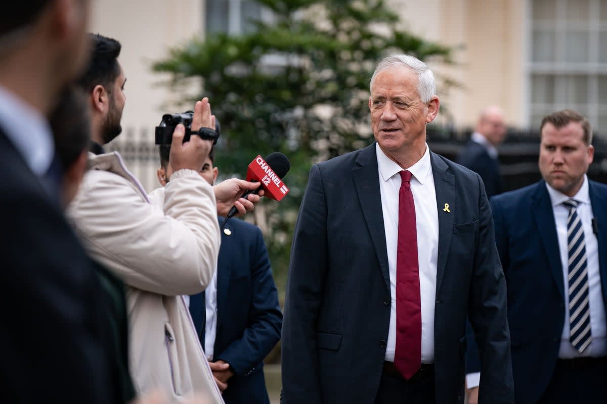 Benny Gantz speaks to media outside Carlton Gardens in London in March (Aaron Chown/PA Wire)