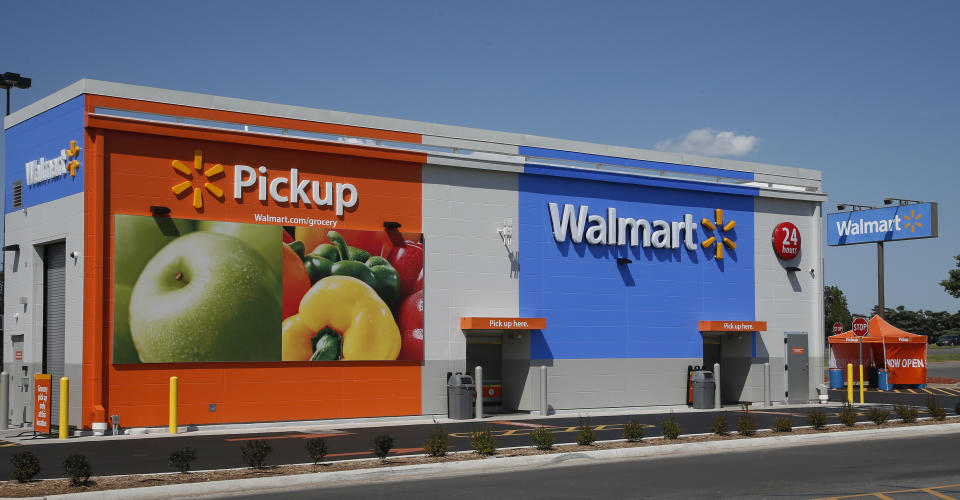 This Tuesday, May 30, 2017, photo shows a 24-hour grocery pickup location at a Walmart in Oklahoma City. Amazon’s planned $13.7 billion acquisition of Whole Foods signals a massive bet that people will opt more for the convenience of online orders and delivery or in-store pickup, putting even more pressure on the already highly competitive industry. Walmart, Kroger and others were already stepping up their efforts in delivery and in-store pickup of online orders. (AP Photo/Sue Ogrocki)