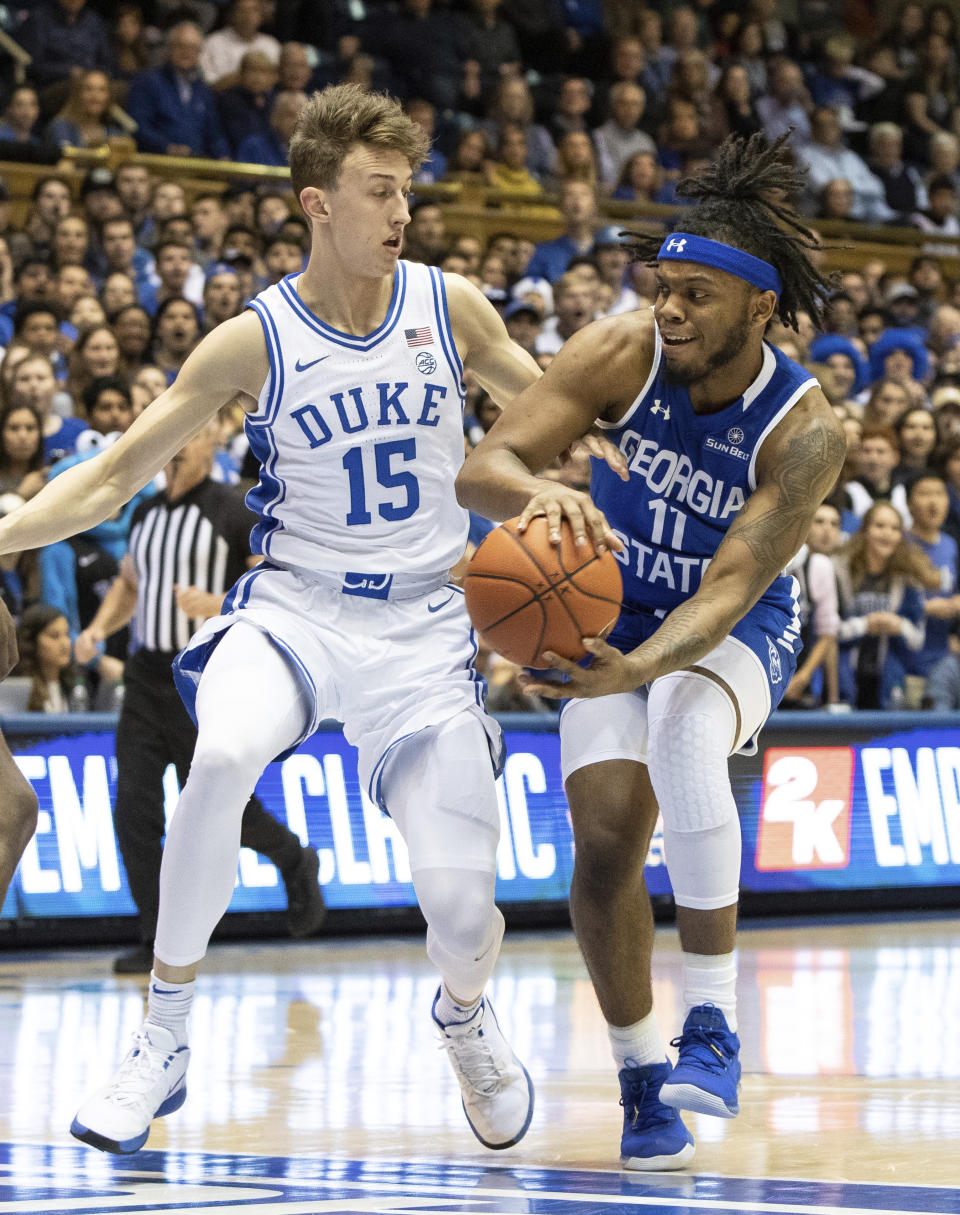 Georgia State's Corey Allen (11) drives against Duke's Alex O'Connell (15) during the first half of an NCAA college basketball game in Durham, N.C., Friday, Nov. 15, 2019. (AP Photo/Ben McKeown)