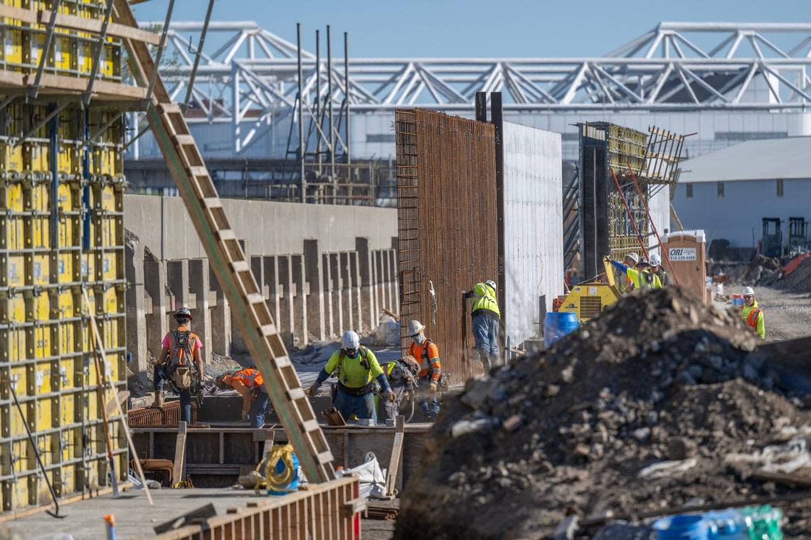 Concrete floodwalls take shape not far from Hy-Vee Arena.