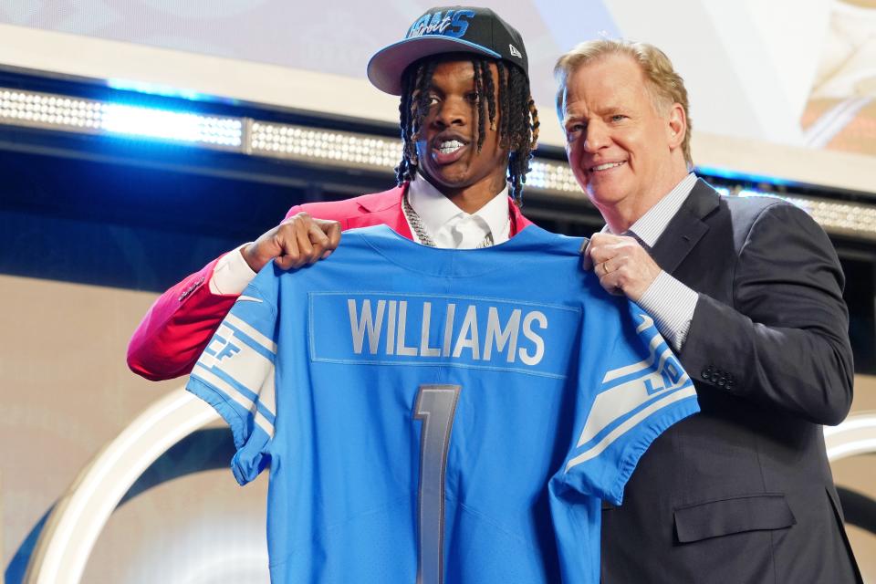 Alabama wide receiver Jameson Williams shown with NFL commissioner Roger Goodell after being selected as the 12th overall pick by the Detroit Lions during the NFL draft.