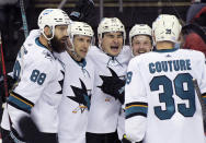 San Jose Sharks right wing Timo Meier (28) celebrates his goal with teammates during the second period of an NHL hockey game against the New Jersey Devils, Tuesday, Nov. 30, 2021, in Newark, N.J. (AP Photo/Bill Kostroun)
