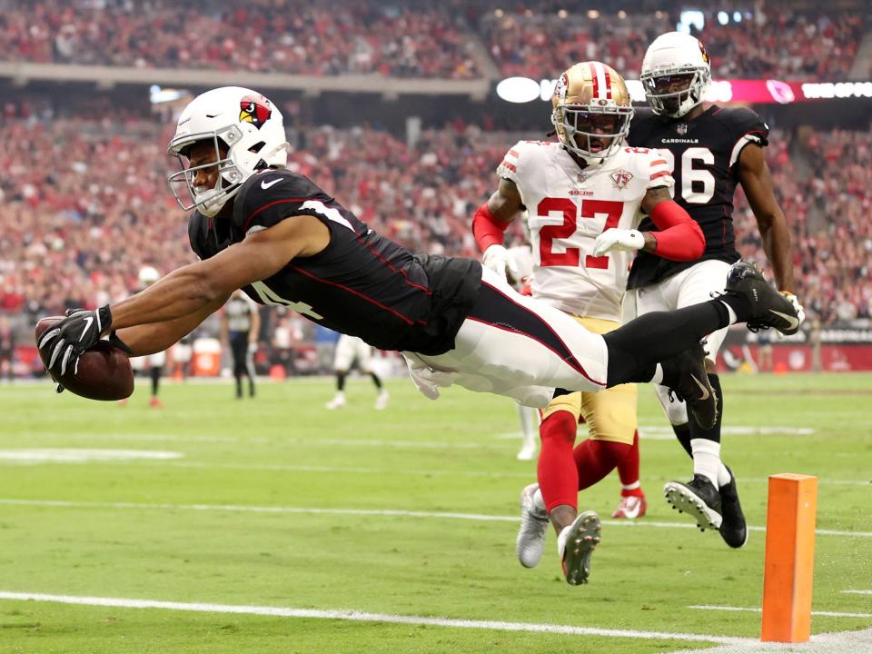 Rondale Moore dives for the end zone against the San Francisco 49ers.