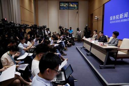 Yang Guang of the Hong Kong and Macau Affairs Office of the State Council attend a news conference in Hong Kong, in Beijing