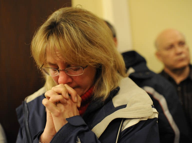 Mourners gather inside the St. Rose Church at a vigil service for victims of the Sandy Hook school shooting in Newtown on December 14, 2012. World leaders have expressed shock and horror after a gunman massacred 20 small children and six teachers Friday in the US state of Connecticut, in one of the worst school shootings in history