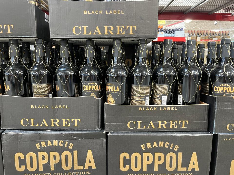 Display of black bottles of Claret