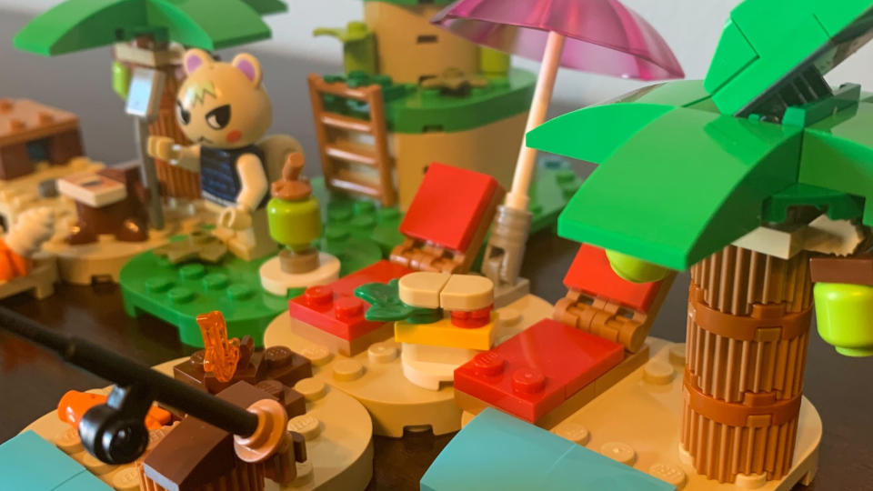 Lego Kapp'n's Island Boat Tour set seen up-close, with a minifigure on a beach scene