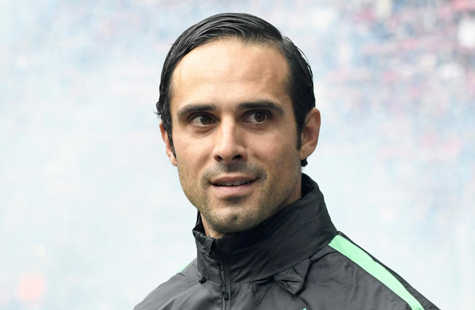 FILE - In this Sunday, Oct. 23, 2016 file photo then coach of German first division soccer team Werder Bremen, Alexander Nouri, smiles prior the Bundesliga soccer match between RB Leipzig and SV Werder Bremen in Leipzig, Germany. Nouri, current assistant coach of the first division team of Hertha BSC Berlin is the successor of head coach Juergen Klinsmann who resigned after nine Bundesliga matches as Berlin's coach. (AP Photo/Jens Meyer)