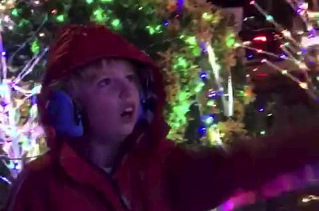Incredible moment a non verbal nine-year-old said his first words - when he read out 'ho ho ho' spelled out by a Christmas light display