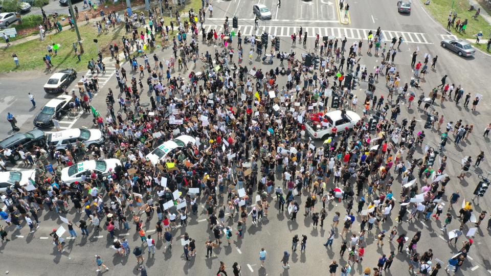 Protesters speaking out against police brutality take to the streets blocking traffic and multiple intersections on Saturday, May 30, 2020 in Tampa, Fla. Protests across the country have escalated over the death of George Floyd who died after being restrained by Minneapolis police officers on Memorial Day, May 25. (Luis Santana/Tampa Bay Times via AP)