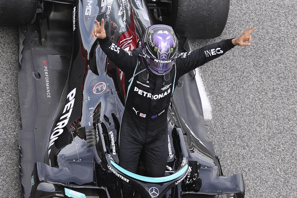 Mercedes driver Lewis Hamilton of Britain celebrates after winning the Spanish Formula One Grand Prix at the Barcelona Catalunya racetrack in Montmelo, just outside Barcelona, Spain, Sunday, May 9, 2021. (Lars Baron/Pool via AP)