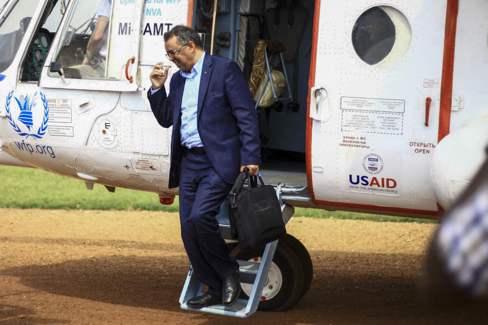 FILE - In this Saturday, June 15, 2019 file photo, World Health Organization Director-General Tedros Adhanom Ghebreyesus arrives by helicopter at Ruhenda airport in Butembo, eastern Congo, to visit operations aimed at preventing the spread of Ebola and treating its victims. A confidential U.N. report into the alleged missteps by senior World Health Organization staffers in how they handled a sexual misconduct case during an Ebola outbreak in Congo found their response didn't violate the agency’s policies because of what some officials described as a “loophole.” The report was submitted to WHO last month and wasn't released publicly. It was obtained by the Associated Press. (AP Photo/Kudra Maliro, File)