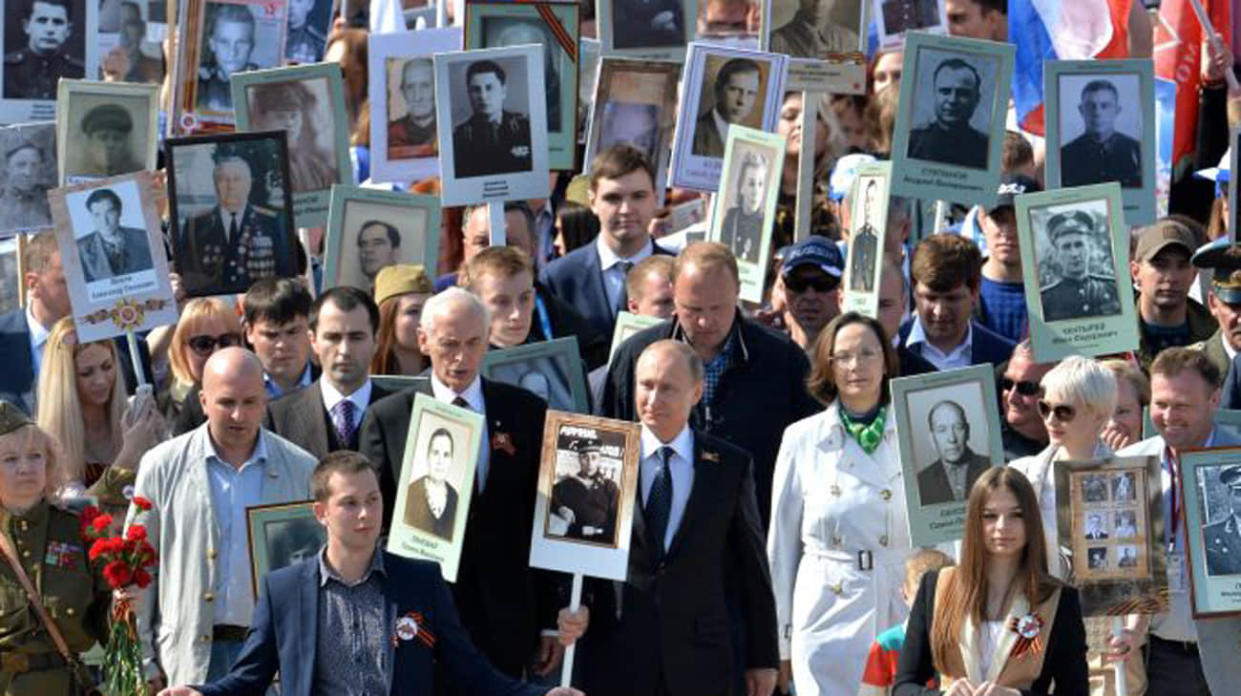 Putin taking part in the Immortal Regiment march. Stock photo: Kremlin