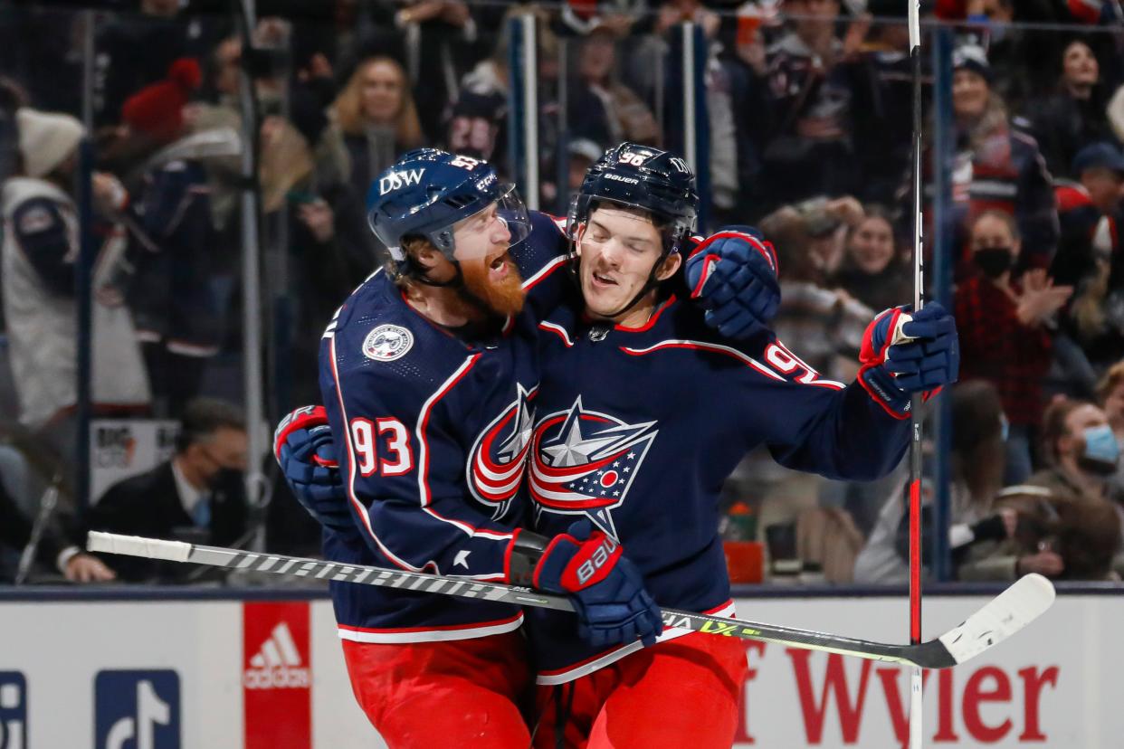 Columbus Blue Jackets center Jack Roslovic (96) and right wing Jakub Voracek (93) celebrate after RoslovicÕs goal during the third period of the NHL game against the Vancouver Canucks at Nationwide Arena in Columbus, Ohio Nov. 26.