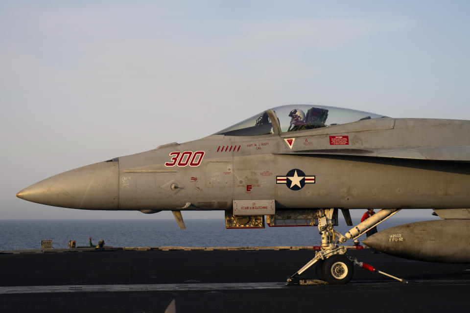 A fighter jet takes off from the USS aircraft carrier Dwight D. Eisenhower, also known as 'IKE', in the Red Sea, Tuesday, June 11, 2024. (AP Photo/Bernat Armangue)