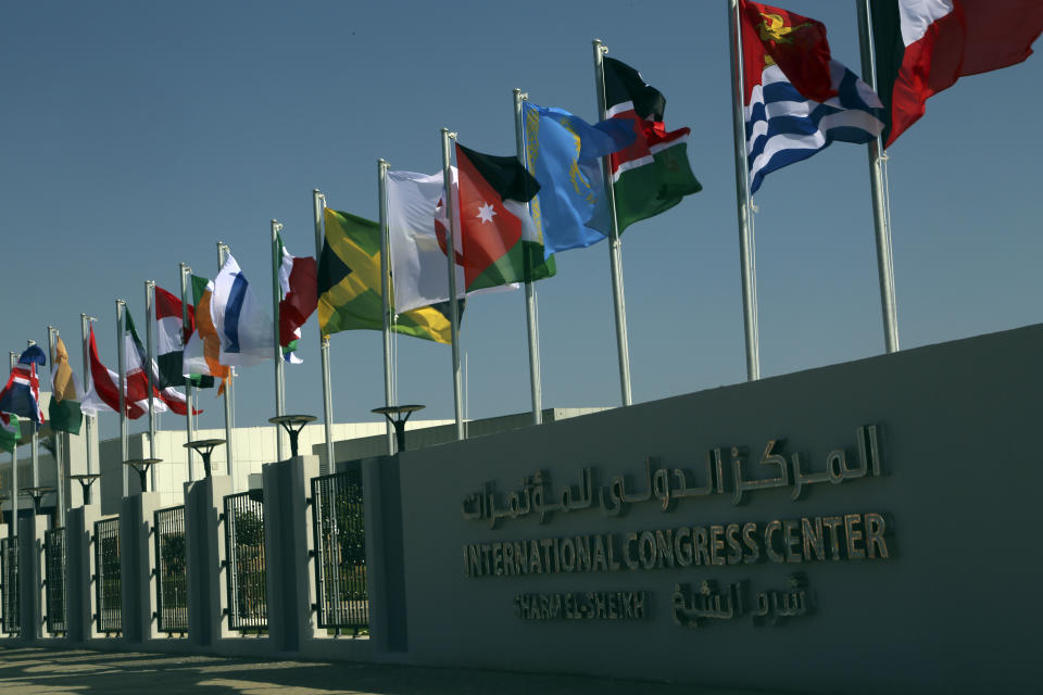 Flags from countries participating in this year’s United Nations global summit on climate change, known as COP27, hang outside the conference center, in Sharm el-Sheikh, South Sinai, Egypt, Wednesday, Nov. 2, 2022. As this year’s United Nations climate summit approaches, Egypt’s government is touting its efforts to make Sharm el-Sheikh a more eco-friendly tourist destination. (AP Photo/Thomas Hartwell)