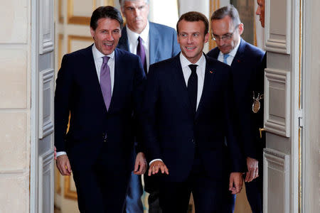 French President Emmanuel Macron and Italian Prime Minister Giuseppe Conte arrive for a joint news conference at the Elysee Palace in Paris, France, June 15, 2018. Francois Mori/Pool via Reuters