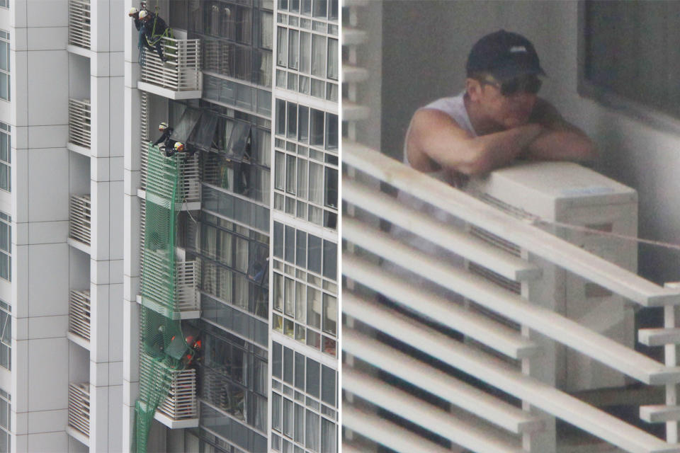 SCDF officers (left) seen deploying netting, presumably in an attempt to prevent the man (right) from jumping off the seventh-floor ledge at the Icon Residence condominium. (PHOTOS: Dhany Osman / Yahoo News Singapore)