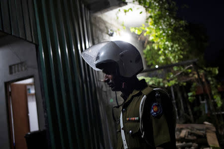 A police officer stands inside a training camp allegedly linked to Islamist militants, in Kattankudy near Batticaloa, Sri Lanka, May 5, 2019. REUTERS/Danish Siddiqui