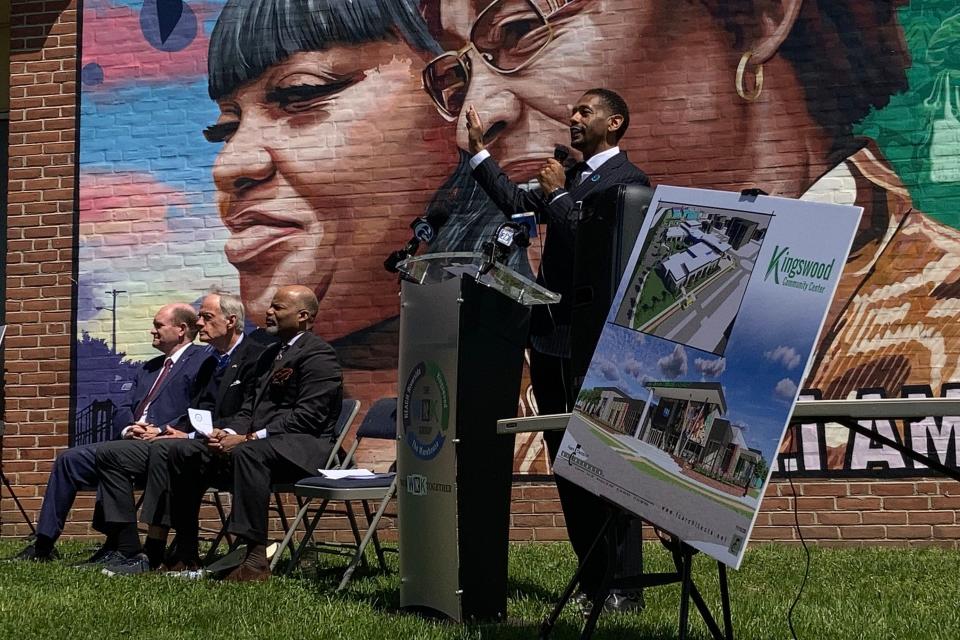 Kingswood Community Center Chief Executive Officer Logan Herring, right, speaks during a press conference announcing a $10 million award for a new Kingswood Community Center Friday, April 15, 2022. 