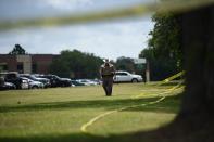 <p>Police officers patrol outside Santa Fe High School on May 19, 2018, in Santa Fe, Texas. (Photo: Brendan Smialowski/AFP/Getty Images) </p>