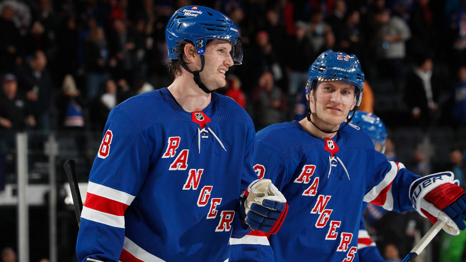 Jacob Trouba #8 and Adam Fox #23 of the New York Rangers are two players who bring different skills to the table in fantasy hockey. (Photo by Jared Silber/NHLI via Getty Images)