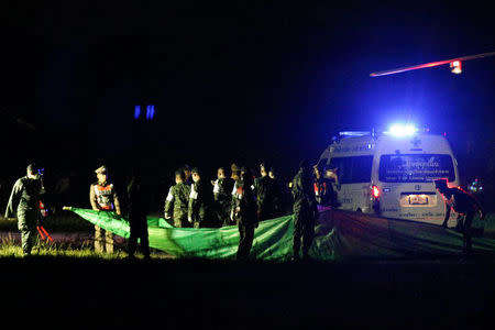 Rescued schoolboys are moved from a military helicopter to an awaiting ambulance at a military airport in Chiang Rai, Thailand, July 9, 2018. REUTERS/Athit Perawongmetha