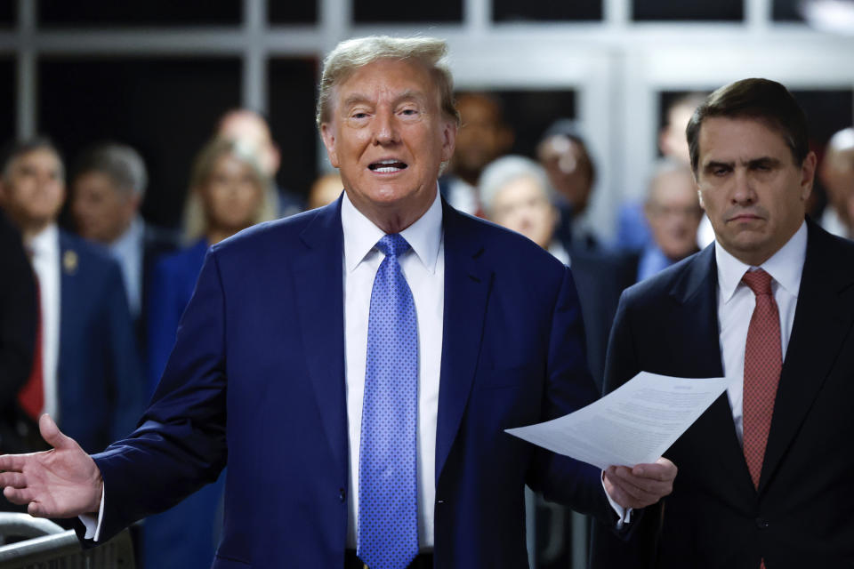 Former President Donald Trump speaks to members of the media before entering the courtroom with his attorney Todd Blanche at Manhattan Criminal Court on Monday, May 20, 2024 in New York. (Michael M. Santiago/Pool Photo via AP)