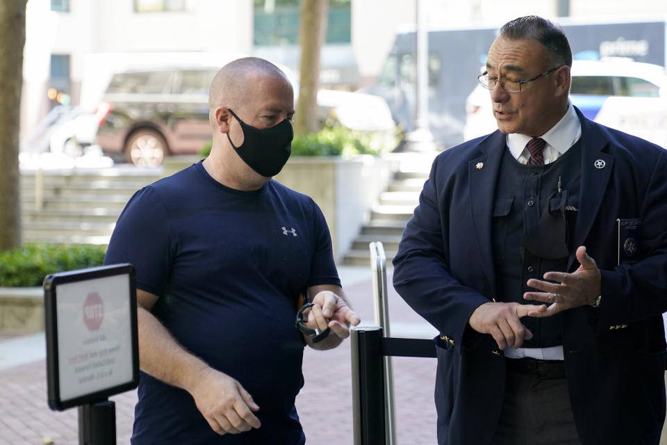 James Theodore Highhouse, left, arrives for his sentencing hearing at U.S. District Court in Oakland, Calif., Wednesday, Aug. 31, 2022. Highhouse pleaded guilty to sexually abusing an inmate while working as a prison chaplain at a federal women's prison in Dublin, Calif. (AP Photo/Godofredo A. Vásquez)