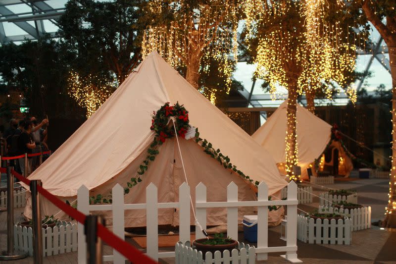 Glamping tents decked out in Christmas decorations and a backdrop of fairy lights are seen at Changi Airport, Singapore