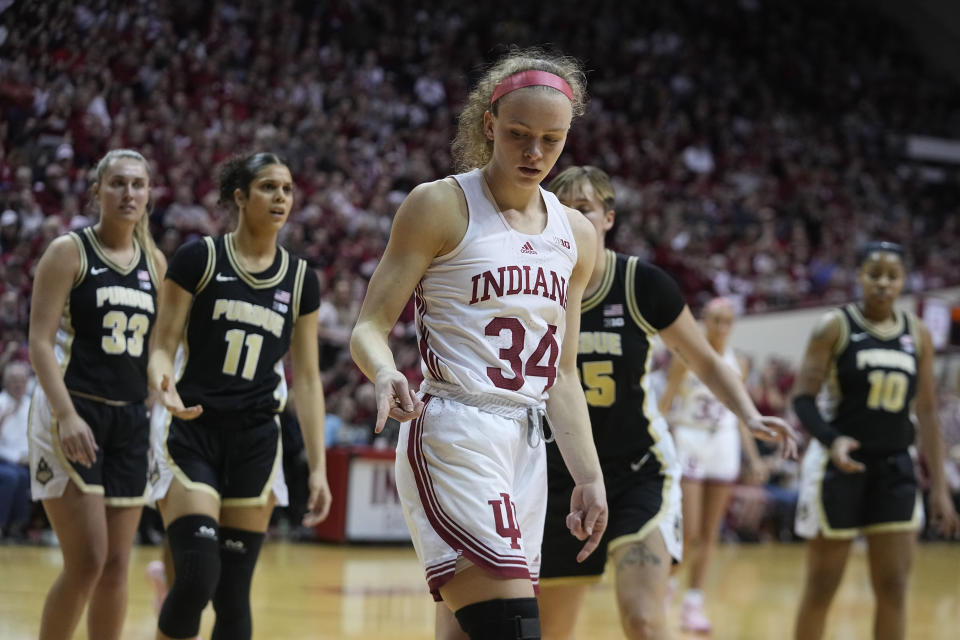 Indiana's Grace Berger (34) reacts after making a basket and getting fouled during the second half of an NCAA college basketball game against Purdue, Sunday, Feb. 19, 2023, in Bloomington, Ind. (AP Photo/Darron Cummings)