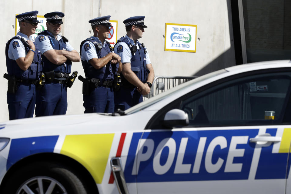 Police keep watch outside Friday prayers at an arena in Christchurch, New Zealand, Friday, March 13, 2020. Events to mark the death of 51 people who were killed and dozens more injured when a gunman attacked two mosques in Christchurch March 15, 2019 begin Friday. (AP Photo/Mark Baker)