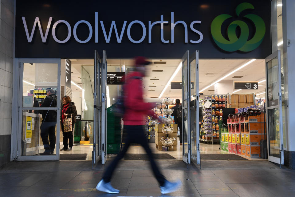 A stock photo of a man walking past Woolworths. Most Woolworths supermarkets in Western Australia will observe normal trading hours for Foundation Day.