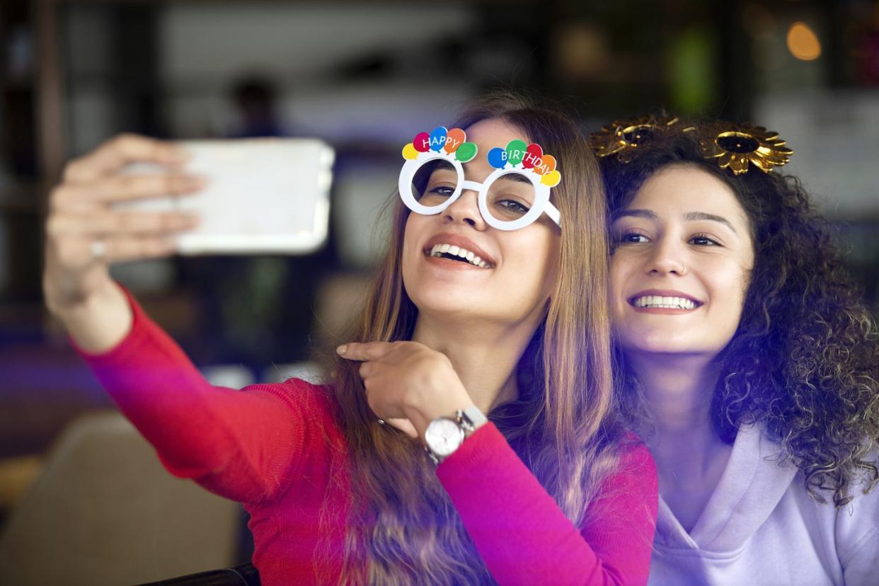 funny girls taking selfies at the birthday celebration