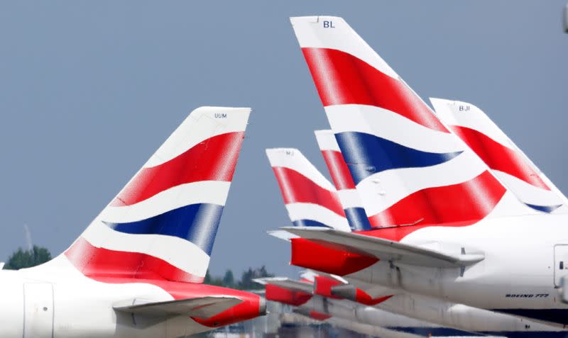 FILE PHOTO: British Airways tail fins are pictured at Heathrow Airport in London