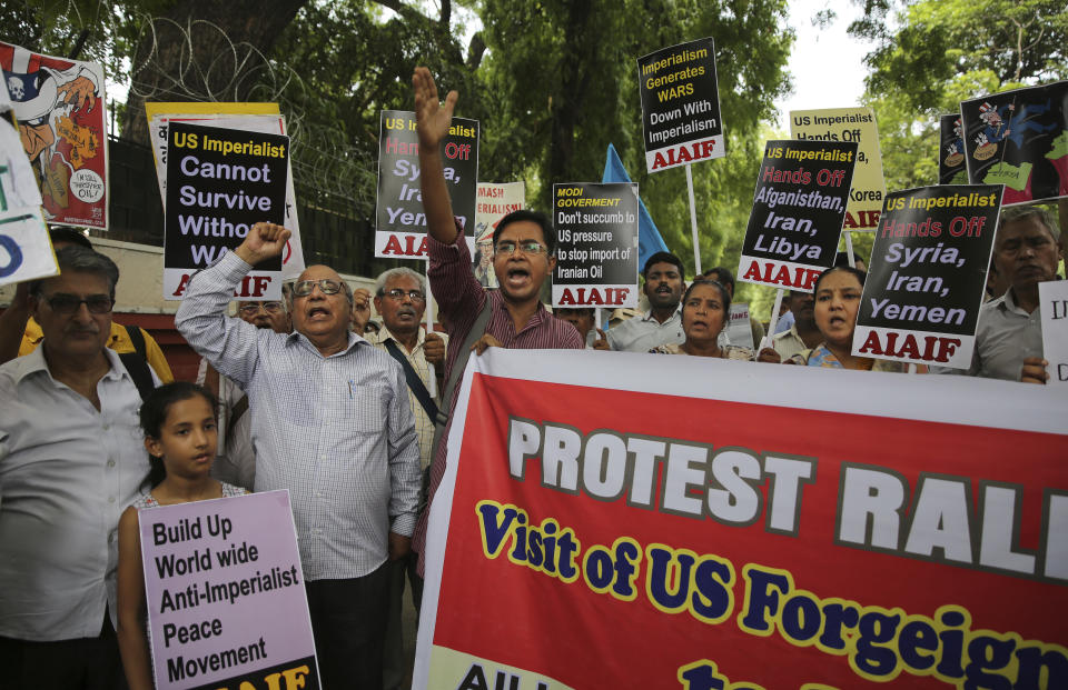 Activists of various left organizations denounce American policies while protesting against the upcoming visit of U.S. Secretary of State Mike Pompeo to India, in New Delhi, India, Tuesday, June 25, 2019. Pompeo is scheduled to travel to India after having visited Saudi Arabia and the United Arab Emirates, on a trip aimed at building a global coalition to counter Iran. (AP Photo/Altaf Qadri)