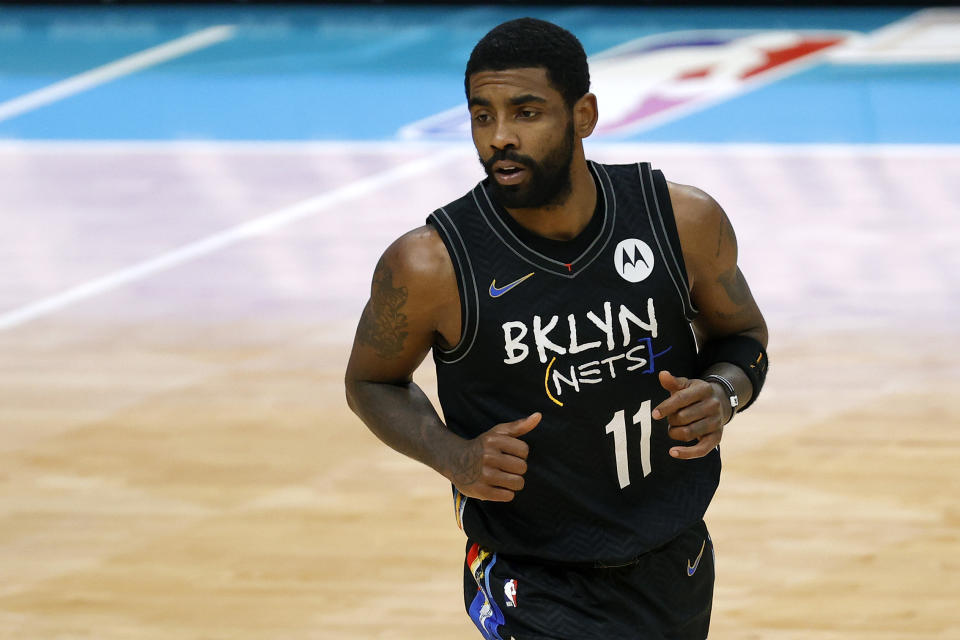 Kyrie Irving #11 of the Brooklyn Nets runs the court during the fourth quarter of their game against the Charlotte Hornets at Spectrum Center on December 27, 2020 in Charlotte, North Carolina