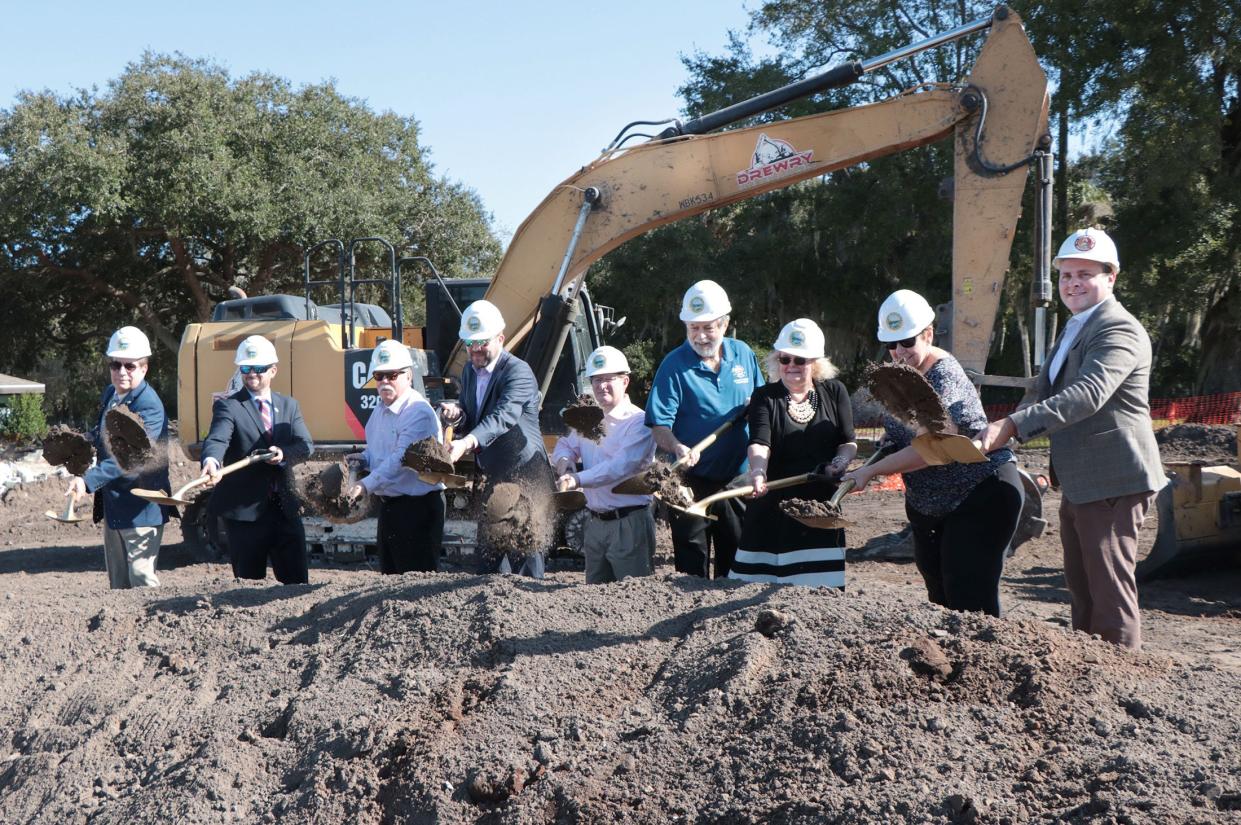 Elected officials Friday toss shovels of dirt during the groundbreaking ceremony for Greenlawn Manor, the New Smyrna Beach Housing Authority's affordable senior housing project.