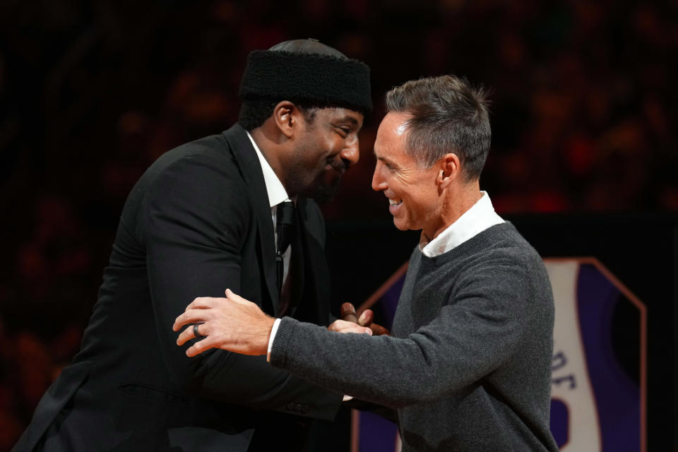 Former Phoenix Suns player Amar'e Stoudemire hugs former teammate Steve Nash during his Ring of Honor ceremony during the game against the Houston Rockets at Footprint Center in Phoenix on March 2, 2024.