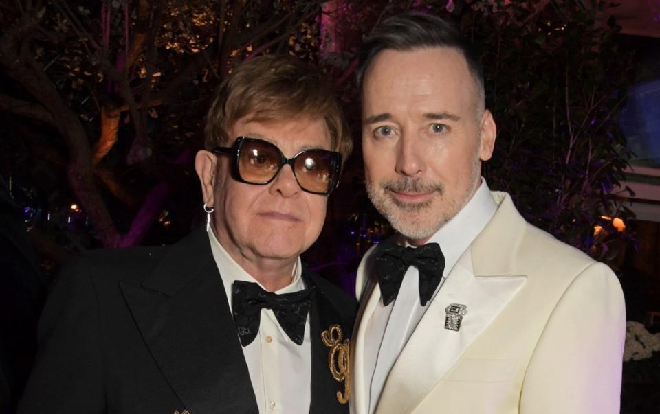 Sir Elton John and his partner David Furnish are also part of the group launching legal action - David M. Benett 