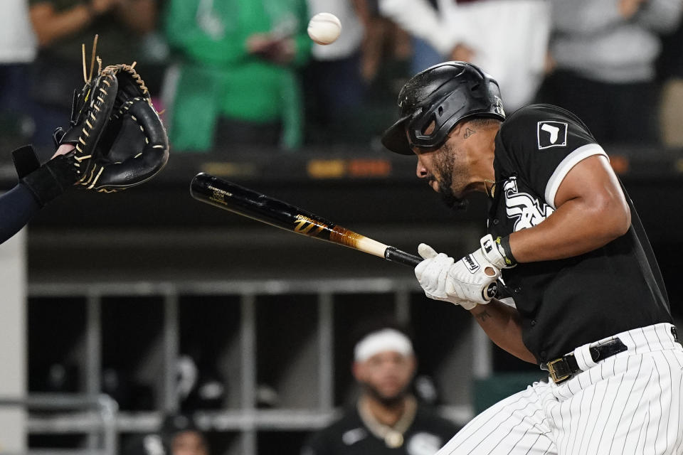 Chicago White Sox's Jose Abreu is hit by a pitch during the eighth inning of the team's baseball game against the Cleveland Indians in Chicago, Friday, July 30, 2021. (AP Photo/Nam Y. Huh)