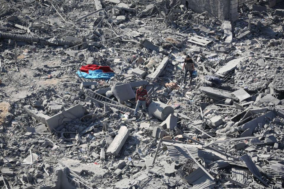 PHOTO: Citizens inspect damage to their homes caused by Israeli airstrikes, Oct. 13, 2023 in Gaza City, Gaza. (Ahmad Hasaballah/Getty Images)