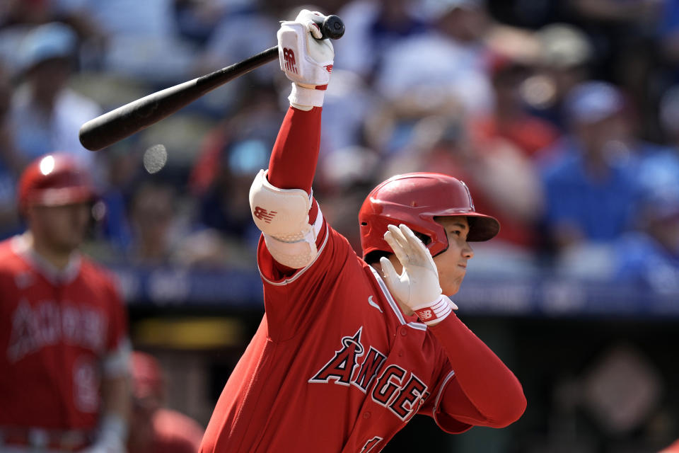 Los Angeles Angels' Shohei Ohtani, from Japan, watches his force out scoring one run during the fifth inning of a baseball game against the Kansas City Royals Saturday, June 17, 2023, in Kansas City, Mo. (AP Photo/Charlie Riedel)