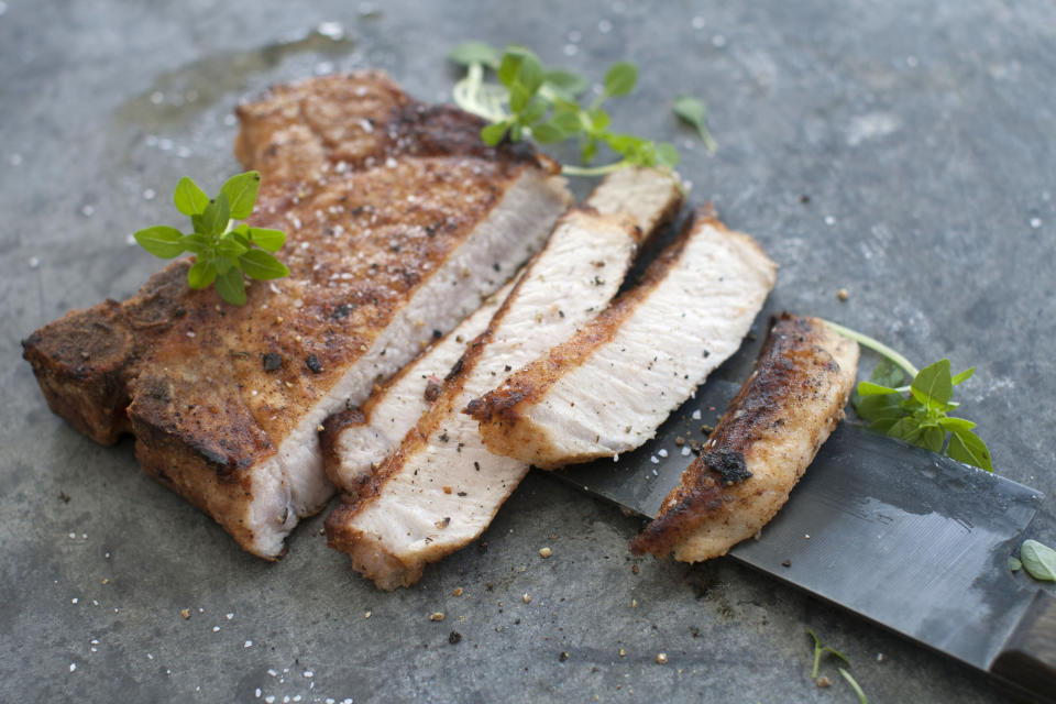 This March 17, 2014 photo shows flavored pork chops in Concord, N.H. (AP Photo/Matthew Mead)