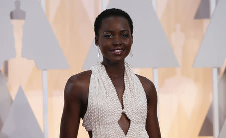 Actress Lupita Nyong'o wears a Calvin Klein gown and Chopard diamonds as she arrives at the 87th Academy Awards in Hollywood, California February 22, 2015. REUTERS/Mario Anzuoni