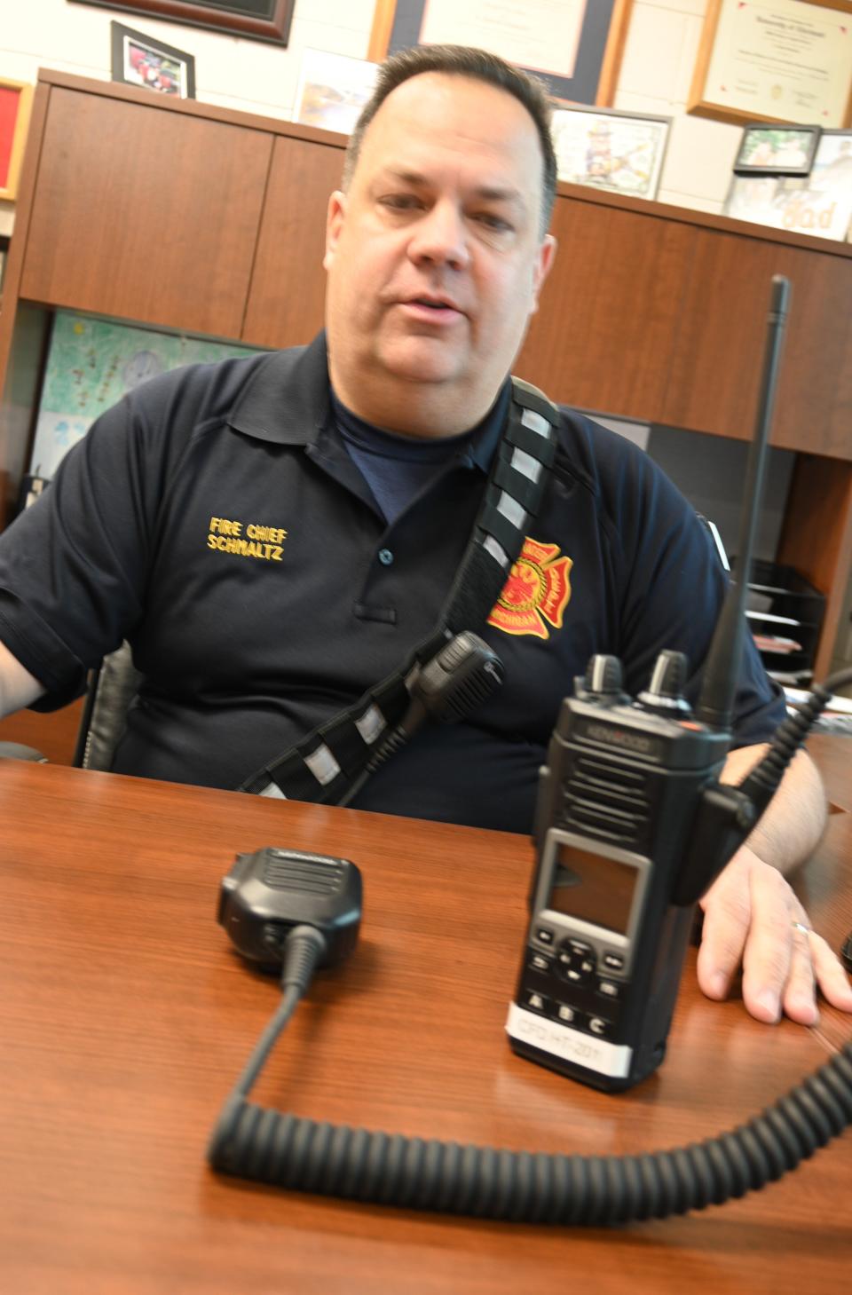 Chief Smaltz with a new 800 MHZ portable radio. All local emergency services will go to these units by March.