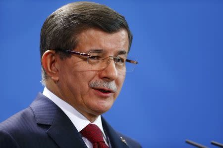 Turkish Prime Minister Ahmet Davutoglu speaks during a joint news conference with German Chancellor Angela Merkel at the Chancellery in Berlin, Germany, January 22, 2016. REUTERS/Hannibal Hanschke