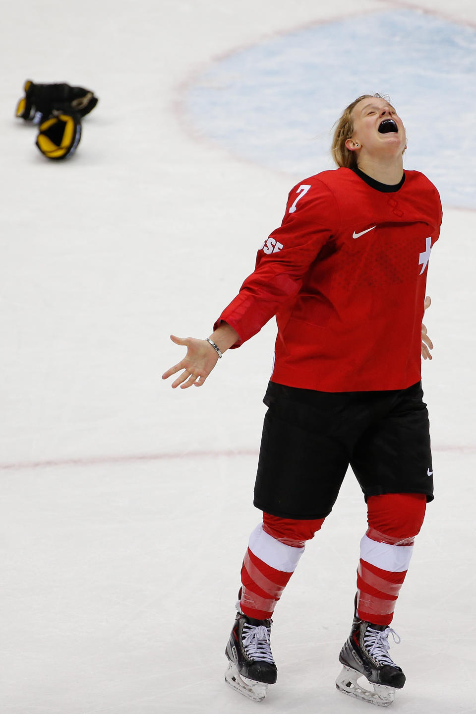 Lara Stalder of Switzerland (7) celebrates her team's 4-3 win over Sweden in the women's bronze medal ice hockey game at the 2014 Winter Olympics, Thursday, Feb. 20, 2014, in Sochi, Russia. (AP Photo/Petr David Josek)